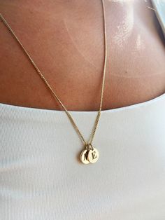 This 14k gold disk necklace is made of real 14k Solid Gold. We can produce this engraved small disc necklace in White or Rose Gold too, please add to order notes. You can add as much as disks you want to this disks addable chain, all you need to choose from the options. Logo engraved charm is solid, not hollow. Chain and discs are thick, solid and high quality. Necklace on pictures is 6,6 gr. Necklace on pictures is 23,62 inch length, with 2 discs. We can engrave on discs monogram, crest, letter Everyday Gold Engraved Medallion Necklace, 14k Gold Jewelry With Coin Pendant And Round Disc, Gold Sterling Silver Round Disc Charm Necklace, Classic Charm Necklaces With Coin Pendant, Everyday Engraved Gold Plated Charm Necklaces, Classic Gold Engraved Initial Necklace, Everyday Gold Plated Engraved Charm Necklaces, Classic Yellow Gold Charm Necklace With Coin Pendant, Everyday Gold Round Disc Charm Necklace