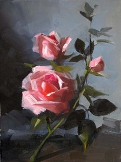 two pink roses in a vase on a table