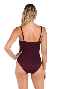 Sunbathe seaside in this lingerie one-piece swimsuit by La Blanca. The delicate and simple lingerie shape exudes a simple, feminine style. Adjustable straps and removable cups allow this piece to fit to you. Slimming fabric finishes the smooth, delicate look. Moderate rear coverage. [split] Details One piece swimsuit Shirred side seams Removable cups Adjustable straps Slimming fit (shirred body) Fabric 83% Nylon, 17% Elastane Fitted One-piece Swimwear With Adjustable Straps, Simple Feminine Style, Fitted Low-cut Swimwear With Adjustable Straps, Fabric Finishes, Red Cutout One-piece Swimwear, Black One-piece Swimwear With Adjustable Straps, Black V-neck One Piece Beachwear, Feminine Style, One Piece Swimsuit