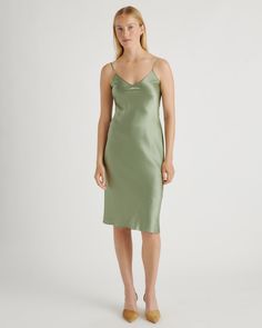 We love the midi length and bias cut of this dress! This super flattering fit is made from 100% mulberry silk, in a satin finish. The kicker? Our silk is washable. Easy to style, easy to wash for low-maintenance luxe. Plus, silk fiber contains 18 kinds of amino acids that make it amazing for skin nourishment, hypo-allergenic, and naturally thermoregulating to help maintain body temperature. Sleek Satin V-neck Midi Dress, Green Midi Slip Dress For Formal Occasions, Green Midi Slip Dress For Formal Events, Sleek Modal Satin V-neck Silk Dress, Fitted Knee-length Bias Cut Satin Dress, Green Silk V-neck Slip Dress, Fitted Knee-length Satin Dress With Bias Cut, Knee-length Bias Cut Dress For Date Night, Bias Cut Knee-length Dress For Date Night