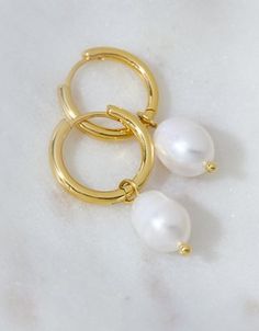 Designed in polished 14K gold-plated metal, these made-to-last huggie earrings are set with a genuine pearl for an elegant finish. Gift Wishlist, Pearl Hoop Earrings, Jewelry Lookbook, Huggie Earrings, Huggies Earrings, American Eagle Outfitters, Women's Jeans, American Eagle, Pearl Earrings