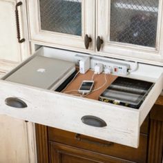 an open laptop computer sitting on top of a wooden desk