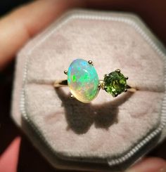 ABOUT PRODUCT:- Our Opal and Peridot Unique Ring is a breathtaking piece of jewelry, featuring a 10*14mm oval peridot and a 6mm round opal. The peridot's vibrant green hue perfectly complements the opal's iridescence, creating a stunning contrast. Crafted with precision and care, this ring is both durable and comfortable, making it perfect for everyday wear. The unique design ensures that it will be treasured for years to come. Stone: Opal & Peridot gemstone Opal size: 10*12 mm Peridot size: 6 m Opal And Peridot Ring, Peridot And Opal Ring, Elegant Green Opal Ring In 14k Gold, Green Opal Oval Ring In 14k Gold, Exquisite Opal Ring Gift, Exquisite Opal Ring For Gift, Opal Ring With Accent Stones As Gift, Fine Jewelry Opal Ring With Accent Stones As Gift, Yellow Gold Sterling Silver Opal Ring For Gift