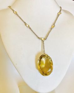 Hand crafted multi gemstones Citrine long lariat necklace made in 92.5 sterling silver (UK Hallmark).  The necklace has a large 129 carats oval cut yellow Citrine pendant, with 13 small bezel setting oval Citrine  of size 9mm x 7mm x 5.2mm approx.. on the chain.     The length of the chain is 62cm (24.4 inches) , and can be extended to 65cm (25.6 inches) All natural gemstones. Citrine Clarity - Transparent Type                - Natural Citrine Colour             - Yellow 92.5 sterling silver, UK Cocktail Necklace, Multi Gemstone Necklace, Citrine Jewelry, Peridot Necklace, Citrine Pendant, Citrine Necklace, Emerald Necklace, Yellow Citrine, Natural Citrine