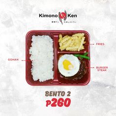 an image of a bento box with rice, meat and fried egg on it