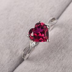 ◆ The ring is handcrafted from sterling silver and decorated with a dazzling 8*8 mm ruby and CZs. It is suitable for engagement/anniversary/daily occasion. ◆ Production Description: Main stone Type: Lab Ruby Main Stone Shape: Heart Cut Main Stone Size: 8*8 mm(2.59ct) Side stone: CZ Metal: 925 Sterling silver - Other options available in the drop down menu ◆ Customization: √Free for Add Engraving √Other Metal Type Available √Other Gemstones & Shapes Available √Personalization Requests Available ◆ Sterling Silver Ruby Rings, Heart Shaped Ruby Ring, Silver Crystal Ring For Valentine's Day Proposal, Valentine's Day Silver Heart Birthstone Ring, Ruby Rings With Accent Stones For Promise, Heart-shaped White Gold Birthstone Ring For Valentine's Day, Ruby Promise Ring With Accent Stones, Valentine's Day Gift Rings With Cubic Zirconia, Fine Jewelry Solitaire Diamond Ring For Valentine's Day