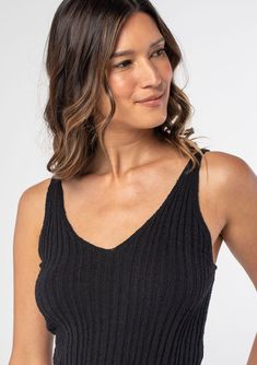 We love this ribbed knit tank top for its slim fit and ultra-flattering neckline. A touch of stretch helps to maintain its shape. A super versatile style that pairs well with jeans or a bohemian skirt. Ribbed knit Slim fit Sleeveless V-neckline Adjustable straps Basic knit tank top Model is 5'9, wearing a size S.Style: I-51011K-RWO Summer Ribbed Tank Knit Top, Casual Ribbed Knit Tank Top, Ribbed Tops For Vacation, Chic Stretch Tank Top For Vacation, Ribbed V-neck Camisole For Summer, Chic Seamless Tank Top For Day Out, Summer V-neck Ribbed Camisole, Trendy Ribbed Knit Top With Scoop Neck, Seamless Stretch Knit Top