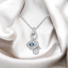 Discover protection and elegance with our 925 Sterling Silver Evil Eye and Hamsa Pendant Necklace, adorned with CZ and colored enamel. You can select size of the chain that is already included. Spiritual Silver Charm Necklace With Clavicle Chain, Silver Spiritual Necklace With Cubic Zirconia, Spiritual Silver Necklace With Cubic Zirconia, Spiritual Silver Cubic Zirconia Necklace, Symbolic Chain Jewelry As Gift, Silver Cubic Zirconia Charm Necklaces For Jewelry Making, Fine Jewelry Sterling Silver Pendant Charm Necklace, Fine Jewelry Sterling Silver Pendant Necklace, Silver Pendant Necklace With Charms