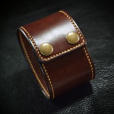 "This brown leather cuff bracelet uses beautiful bridle leather! The perimeter is handstitched in rich gold thread and the edges are beveled, slicked smooth and sealed.  2 high quality aged brass snaps provide the closure. I'll need your wrist size for this cuff. Instructions in the pics above! Can be made in Black bridle leather as well. Just ask! Also available with silver snaps! - 2\" wide - Rich brown bridle leather - Snap closure Thx! Freddie LIVE●LOVE♥LEATHER ✻ Please leave all size inform Classic Brown Leather Bracelet With Wrist Strap, Classic Brown Leather Bracelet, Luxury Leather Cuff Bracelets, Formal Leather Cuff Bracelets, Gold Leather Cuff Bracelet For Formal Occasions, Formal Gold Leather Cuff Bracelet, Leather Cuff Wristband With Bracelet Strap, Leather Cuff Bracelet For Formal Occasions, Adjustable Leather Cuff Bracelet For Formal Occasions