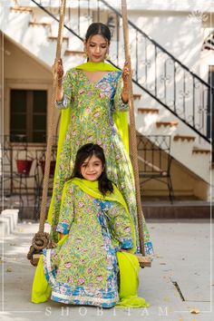 Item: 3 Piece Anarkali Set for Girl Kid ( matching Women's 3 piece anarkali is available to purchase separately)  When it comes to twinning and rocking ethnic attires, nothing beats a mother-daughter duo! Handcrafted with grace, this anarkali has a unique amalgamation of two complimenting block print fabrics in the shades of Lime green and ferozi blue. With beautiful long latkans, along with handwork passing through the neckline, this anarkali is perfect for any special occasion. To make it look Yellow Block Print Anarkali Set For Diwali, Pista Green Cotton Anarkali Set For Eid, Anarkali Churidar With Block Print For Eid, Green Cotton Anarkali Set With Dabka Details, Diwali Multicolor Churidar With Block Print, Designer Kalamkari Print Anarkali Set For Eid, Fitted Anarkali Set With Kalamkari Print For Festive Season, Fitted Anarkali Set With Printed Motifs For Eid, Traditional Multicolor Sharara With Printed Border