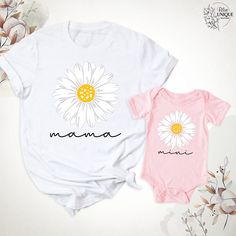 Daisy Mama Mini T-Shirt, Mama And Me Groovy Daisy Flower Shirt, Mom Baby Matching Birthday Party Shirts, Mama And Mini Tees, Mothers Day Tee. Hello, Welcome to Blue Unique Boutique, your destination for unique and handcrafted shirts! I'm Eve! I have been thinking about creating my business for a long time and now I have taken the first step towards it and it gives me excitement. As a small business, I take pride in creating unique designs from the comfort of our homes. Each shirt is carefully cr White Cartoon Print T-shirt For Spring, Family Matching White T-shirt With Cartoon Print, Family Matching Cartoon Print T-shirt For Summer, Pink T-shirt With Name Print For Summer, Summer Pink T-shirt With Name Print, White T-shirt For Summer Gift, Matching Crew Neck T-shirt For First Birthday, White Cartoon Print Shirt For Spring, Cute Tops With Name Print For First Birthday