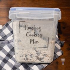 a plastic container filled with cookie mix sitting on top of a table