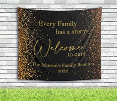 a black and gold wall hanging with the words, every family has a story welcome to our