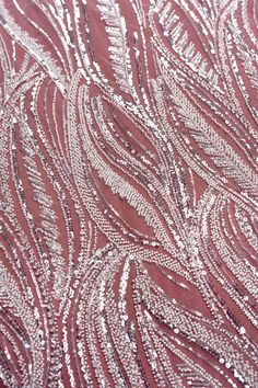 red and white fabric with silver sequins on it's surface, closeup