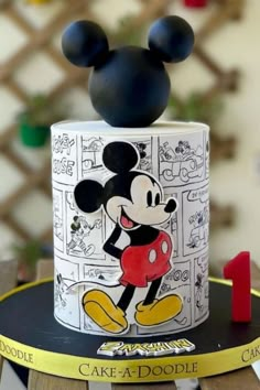 a mickey mouse cake on top of a table