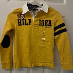 Size Small 6/7 New With Tags Yellow Graphic Print Shirt For Fall, Yellow Fitted School Top, Yellow Fitted Tops For School, Mustard Long Sleeve Casual Shirt, Yellow Long Sleeve Cotton Top, Yellow Cotton Long Sleeve Tops, Mustard Cotton Tops For Winter, Yellow Cotton Tommy Hilfiger Top, Yellow Tommy Hilfiger Cotton Top