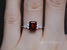 Emerald Cut Natural Garnet ring, made with 925 sterling silver, plated with white gold, beautiful promise ring, special gift for anniversary.Main Stone: Natural GarnetCut: EmeraldMeasurerment: 6*8 mm Side Stone: CZCS0328 Elegant Garnet Ring With Prong Setting, Elegant Ruby Ring With Center Stone For Promise, Formal Sterling Silver Birthstone Ring, Elegant Promise Ruby Ring With Halo Setting, Elegant Sterling Silver Birthstone Ring With Gemstone, Elegant White Gold Ruby Ring For Anniversary, Formal Sterling Silver Birthstone Ring With Accent Stones, Elegant Sterling Silver Ruby Open Ring, Elegant Ruby Ring With Halo Setting For Gift