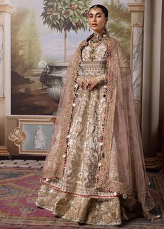 Pakistani Wedding Dress in Pishwas and Lehenga Style is a stunning masterpiece that gives you a head-turning appearance on the big day. Luxury intricate designs and fine details make this beautiful Pishwas and Lehenga Dress your priority for the wedding. Pakistani Pishwas Pakistani Pishwas Frock has an alluring white shade and it comes in premium organza fabric. Embroidery and tilla work give a traditional touch to this beautiful Pishwas Dress. Sequins and goldwork enhance the charm of this roya Floor-length Naqshi Sharara For Reception, White Naqshi Anarkali Set For Wedding, Organza Lehenga With Naqshi For Reception, Traditional Naqshi Festive Gown, Festive Sherwani With Sheer Dupatta For Wedding, Festive Wedding Sherwani With Sheer Dupatta, Elegant Gown With Naqshi For Reception, Elegant Reception Gown With Naqshi Detailing, Traditional Organza Dress With Naqshi Detailing