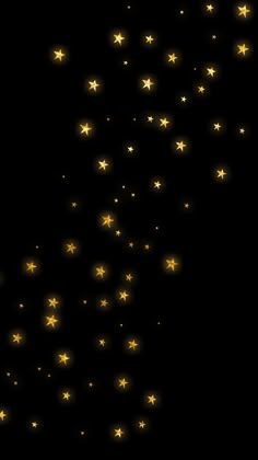 gold stars falling down into the dark sky