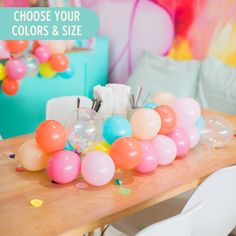 balloons and confetti on a table in a room