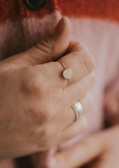 Our Rosie ring is made with a stunning Rose Quartz stone. Known as the crystal of unconditional love, it's said to boost feelings of self-love and foster loving relationships with others. It’s a crystal connected to the heart chakra which colors our life with compassion, love and beauty. 8mm round or 6x8mm round rose quartz stone. Ring band measures 1mm wide. Available in 14kt Gold Fill + Sterling Silver. Rediert pairs it with our Supermoon Ring and Teeny-Tiny Band. Kayla pairs it with two Confe Copper Uses, Everyday Wear Jewelry, Midi Rings, Rose Quartz Stone, Ring Sizer, Relationships Love, Jewelry Cleaner, Quartz Stone, Heart Chakra