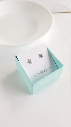 North Star Earring Stus in Sterling Silver Size: 6mm Material: Sterling Silver, rhodium or 18k gold plated over sterling silver, Cubic Zirconia Sold as a PAIR Comes in gift boxes 925 sterling silver butterfly earring backs, and extra couple pairs of silicon earring backs will be included. Hypoallergenic, safe for sensitive skin. FOR HYGIENE REASONS, PLEASE NO RETURNS ON THE EARRINGS. BUT PLEASE CONTACT US IF YOU ARE NOT SATISFIED WITH YOUR PURCHASE. CUSTOMER SATISFACTION IS GUARANTEE IN OUR SHOP Silver Butterfly Earrings, Star Earring, Butterfly Earring, Star Stud Earrings, Stud Earrings Silver, Tiny Star, Star Earrings Stud, Earring Studs, Jewelry Sterling Silver