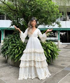 Handmade layer Deep v neck lace trim  wedding dress. Angel sleeves with lace trim. Double fabric on the chest and back. Lined. Cream color. Elastic waist. each layer with lace trim and fringe. Fringe and lace the color is darker cream if compare with the fabric. Model 5'6 wear 2 inches heels in the photo. One size as the Measurements. Chest: stretch up to 45 inches. Waist 22 stretch up to 45 inches. Sleeve  Hip 52 inches (measure from the inside lining) Length 57 in after iron will be 58 inches. (good length for the wedding dress style) CARE: Machine wash cold. NOTE: All the dresses are already been wash it part of the process. COLOR OF THE DRESS IS SAME AS THE LAST PHOTO Selkie Wedding Dresses, Wedding Dress Angel, Layer Dress Outfit, 2 Inches Heels, Bell Sleeve Wedding Dress, Maxi Dress Maternity, Mexican Inspired Wedding, Layered Maxi Dress, Country Dress