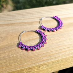 Hand woven seed bead hoop earrings created with fine glass seed beads and Fire-polished beads in shades of Pink delicately woven onto Stainless Steel hoops.     👉  Arrives in a gift box with bow, ready for giving. 🎁 👉  Measurements:  2 inches around. 👉  Lightweight and easy to wear 👉  304 Stainless Steel hoops 👉  Miyuki and Czech glass seed beads 👉  Thermally-fused extra strong thread For different colorways and styles, visit my shop:  https://www.etsy.com/shop/CyntheCreations ⭐  THINGS TO KNOW ABOUT BEADED JEWELRY:  While sealed for normal wear, glass beads are NOT WATERPROOF and should not be worn when swimming or bathing.      Pattern Design by Capital City Beads Nickel Free Small Hoop Beaded Earrings For Festivals, Small Hoop Beaded Earrings With Tiny Beads For Festival, Handmade Beaded Bracelets For Gifts, Festival Small Hoop Earrings With Tiny Beads, Bohemian Purple Hoop Earrings With Round Beads, Festival Hoop Earrings With Tiny Beads, Hoop Earrings With Tiny Round Beads For Festivals, Pink Hoop Beaded Earrings For Festival, Purple Beaded Hoop Earrings With Round Beads