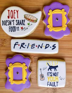 four decorated cookies with funny sayings on them