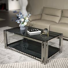 a glass coffee table with flowers on top