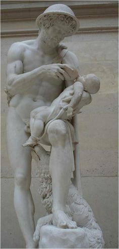 a statue of a man holding a baby in his lap, with the head and shoulders bent down