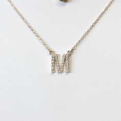 These delicate letters or initial pendants are covered in bright sparkling diamonds. The initial pendant is a very popular gift in our brick and mortar store and comes in yellow, white, and rose 14k gold as well as all the letters of the alphabet! They also make a great layering necklace. Metal: 14K Gold Length: 16 Inches Diamonds: Vary with Letter - Approximately 1/5 CTW, SI2 G SKU:NIL10 **These necklaces are made to order, please allow up to two weeks to complete your order. If you need a rush Silver Initial Pendant Diamond Necklace In 14k Gold, Silver 14k Gold Initial Pendant Diamond Necklace, 14k Gold Silver Diamond Initial Pendant Necklace, Silver Diamond Initial Pendant Necklace In 14k Gold, Silver Diamond Monogram Initial Necklace, Letters Of The Alphabet, Initial Pendant, Layering Necklace, Beautiful Necklace