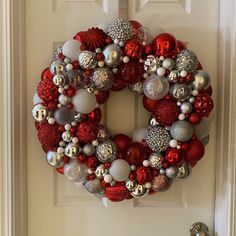 Beautiful festive bulb wreath.  One of a kind ready to display. Reds, white, and silver.  Sparkly and shiny!  I love this one! Red And Silver Bauble Wreath, Ornament Wreath Diy, Bulb Wreath, Ornament Wreaths, Silver Wreath, Christmas Home Decor Ideas, Holiday Deco, Christmas Table Centerpieces, Valentines Crafts