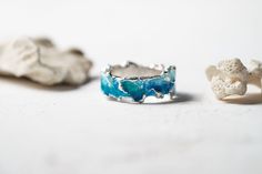 Beautiful ring Wave will bring you back to the sea! This ring is unique! Using hot enamel technique every item receives his own unique texture! https://www.etsy.com/listing/559371911/ - Wide wave ring (10 mm) Details: Width: 5mm Thickness: 1.2 mm Materials: sterling silver 925, hot vitreous enamel These rings in gold: https://www.etsy.com/listing/932462309/ - Gold blue wave https://www.etsy.com/listing/932465221/ - Gold green wave Please provide me size of the ring during the order, thank you! T Ocean-inspired Promise Ring, Blue Enamel Rings For Anniversary, Ocean-inspired Blue Ring For Gift, Ocean-inspired Blue Ring For Gifts, Ocean-inspired Blue Rings As Gifts, Handmade Enamel Wedding Rings, Handmade Enamel Anniversary Ring, Unique Hand Painted Blue Rings, Hand Painted Unique Blue Rings