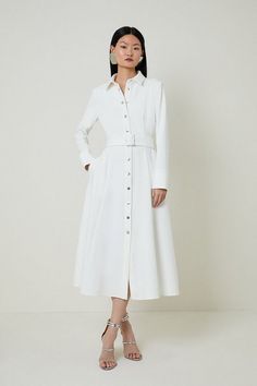 Tailored Compact Stretch Belted Shirt Dress | Karen Millen Belted Midi Length Dress, Chic Belted Maxi Dress For Office, Collared White Midi Dress For Work, Classic White Business Dress, Summer Workwear Maxi Dress With Belt, White Belted Midi Dress For Work, Chic Belted Midi Dress With Buttons, Elegant Buttoned Midi Dress For Daywear, Spring Midi Belted Dress With Button Closure