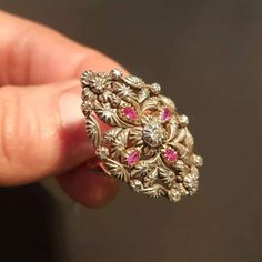 "RING SIZE: 7.5 US 56 EU GOLD: 14 ct. WEIGHT: 11.70 grams SIZE: 35 mm x 23 mm RUBIES: authentic, 0.35 ct. DIAMONDS TOTAL WEIGHT: 0.40 ct CUT: pink cut, in the center is an old European diamond COLOUR: K CLARITY: Si2 CONDITION: EXCELLENT Stunning Art Deco style diamond and ruby ring with a beautiful floral design. The ring features 14 carat gold Hungarian \"fox heads\" from 1867 to 1922. Rose cut diamonds and one old european cut Si2 clarity and K color total 0.40 ct and uncut, genuine rubies 0.3 Gold Ruby Rings With Intricate Design, Gold Ruby Ring With 17 Jewels For Wedding, Ornate Gold Ruby Ring, Gold Ruby Ring With Intricate Design For Anniversary, Anniversary Gold Ruby Ring With Intricate Design, Gold Ruby Ring With Filigree, Gold Ruby Ring With Filigree Detail, Yellow Gold Ruby Ring With Intricate Design For Promise, Gold Ruby Ring With Filigree For Anniversary