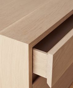 a close up view of the drawers on a wooden dresser