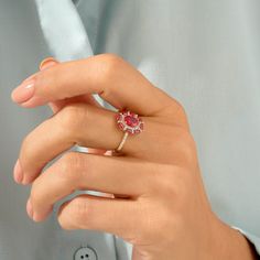 Celebrate your femininity with this gorgeous Ruby Floral Ring. This beautiful flower ring portrays elegance and charm. Made of 14k solid gold. Exquisite Yellow Gold Ruby Ring, Elegant Ruby Rings With Brilliant Cut, Elegant Ruby Ring With Prong Setting, Elegant Ruby Center Stone Ring, Elegant Ruby Ring With Prong Setting For Proposal, Rose Gold Ruby Ring With Halo Design, Fine Jewelry Rose Gold Ruby Ring With Halo Design, Elegant Ruby Ring With Diamond Center Stone, Elegant Ruby Ring With Brilliant Cut