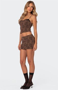 Online Only! Unleash your wild side with the Edin Leopard Print Mesh Mini Skirt from Edikted! Adorned with a charming center bow detail and featuring a fierce leopard print design, this skirt is the epitome of edgy sophistication. Crafted from lined mesh fabric and part of a matching set, it offers both style and comfort for any occasion!


	Mini skirt
	Center bow detail
	Leopard printed design
	Lined mesh fabric
	Low rise
	Matching set
	Polyester, Spandex
	Model wears size S
	Model height is 5'8
	Item care: Wash with similar color Fitted Leopard Print Mini Bottoms, Fitted Leopard Print Mini Skirt For Night Out, Mesh Mini Skirt, Visionary Fashion, Mesh Bra, Swimwear Dress, Skirt Mini, Skirts Online, Bow Detail