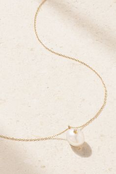 Understated and elegant, Mateo's necklace is the perfect accessory for so many outfits. It's handmade from 14-karat gold and strung with a single pearl that's illuminated by a tiny twinkling diamond. The delicate chain adjusts between three lengths, allowing you to find the ideal drop. Classic Pendant Necklace With Single Strand, White Classic Necklace With Delicate Chain, Classic White Necklace With Delicate Chain, Delicate White Gold Briolette Necklaces, Classic Single Strand Pearl Necklace In 14k Gold, Luxury White Necklace With Delicate Chain, White Luxury Necklace With Delicate Chain, Classic Gold Diamond Necklace With Pearl Pendant, White Gold Akoya Pearl Single Strand Necklace