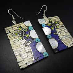 TYRRELL MARTINEZ (SANTO DOMINGO) MULTI-STONE MOSAIC INLAY EARRINGS DESCRIPTION:  These exquisite earrings by Tyrrell Martinez embrace bold colors and reveal depth of artistry. The floral design involves blue lapis, white shell, blue turquoise, and mother of pearl, with a touch of lime green gaspeite. These exceptional earrings will be a cherished addition to your collection of quality Native American jewelry. MEASUREMENTS:  3" (including wires) x 1 1/4" WEIGHT:  28.8 grams SIGNED:  unsigned, by Mosaic Inlay, Shell Mosaic, Native American Earrings, Blue Lapis, Stone Mosaic, Denver Co, American Jewelry, Native American Jewelry, Multi Stone