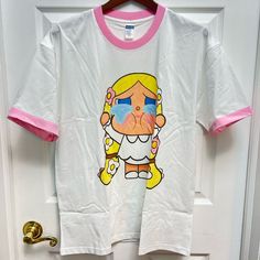 22in Width Under The Armpit 28in Length Shoulder To Bottom 100% Cotton T-Shirt. Super Soft Materials. Popmart Crybaby With Pink Edge Neck And Sleeves. Brand New, Never Worn. Up To 150lb. Only Cold Wash And Air Dry. White Cartoon Print T-shirt For Spring, White T-shirt With Cartoon Print For Spring, Unisex White T-shirt With Cartoon Print, Unisex White T-shirt For Spring, Kawaii White T-shirt For Summer, White Cotton Kawaii T-shirt, White Graphic Tee With Character Print For Babies, White Unisex T-shirt With Character Print, Unisex White T-shirt With Character Print