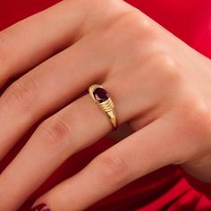 Make a bold and captivating statement with this Garnet Statement Ring. Crafted in your choice of 14k, 18k, or 10k solid gold, this chunky dome ring features a stunning oval-cut garnet gemstone that exudes a rich red hue.   Features * 14k Solid Gold (also in 10k,18k) * Band Options; Yellow Gold, White Gold Rose Gold * Top Width: 5.55 mm * Bottom Width: 1.55 mm * Thickness: 1.40 mm * Gemstone: AAA Grade Genuine Garnet * Gemstone Size: 4.74x2.90 mm * Gemstone Ctw: 0.66 ctw * Ready to Ship 7 Busines Modern Gold Oval Ruby Ring, Modern Oval Ruby Ring In Gold, Modern Oval Gold Ruby Ring, Oval Bezel Setting Signet Ring, Oval Birthstone Ring With Polished Finish, Modern Ruby Promise Ring, Rose Gold Top, January Birthstone Rings, Dome Ring