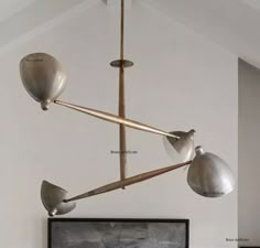 a chandelier hanging from the ceiling in a room