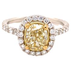 Fancy Light Yellow Halo Diamond Engagement Ring Style: Halo Metal: Platinum & 18kt Yellow Gold Size: 6.75 TCW: 2.39 tcw Main Diamond: Oval Cut Diamond 1.53 cts Color & Clarity: Natural Fancy Light Yelllow, VS1 Accent Diamonds: 56 Round Brilliant Diamonds 0.86 tcw Color & Clarity: G, VS1 - VS2 Hallmark: PLAT 750 Includes: Certified Appraisal - Elegant Ring Box Retail: $16,000 Sku#17470TSTADEN110221-6.75 Engagement Ring Style, Fancy Light, Fancy Lights, Platinum Engagement Rings, Oval Cut Diamond, Engagement Ring Styles, Halo Diamond Engagement Ring, Elegant Ring, Jewelry Rings Engagement