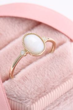 This stunning opal vintage ring is perfect to wear at any occassion. Made in pure gold. #morganitering #diamondring #gemstonering #engagementring #vintagering Exquisite Opal Ring Gift, Exquisite Opal Ring For Gift, Opal And Pearl Ring, Elegant Diamond Ring As Gift, 14k Gold Jewelry With Stones For Wedding, Elegant Birthstone Ring With Stone Setting, 14k Gold Jewelry With Round Stone Setting, 14k Gold Jewelry With Stone Setting, Elegant White Crystal Ring With Gemstone Accents