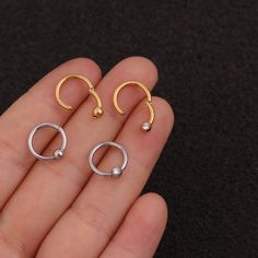 Buying Option: - $14.99 for Single Piece- $19.99 for a Pair (you can choose 2 different earrings)*Comment your option of patterns and color on "Personalization"----------- DESCRIPTIONS ------------ Color: Silver/ Gold - Patterns: Smooth Hoop/ CZ Hoop- Gauge: 16G - 1.2mm- Diameter: 8mm- Stainless Steel Ball: 4mm- Materials: 316L Stainless Steel, 18K Gold Plated, Cubic Zirconia- SKU: HSPJ227- 316L Stainless Steel is hypoallergenic, generally safe for sensitive skin.----------- MIX MATCH PURCHASE - Everyday Hypoallergenic Metal Cartilage Earrings, Everyday Hypoallergenic Cartilage Earrings, Trendy Round Metal Cartilage Earrings, Trendy Adjustable Drop Cartilage Earrings, Single Round Metal Cartilage Earring, Minimalist Internally Threaded Metal Cartilage Earrings, Adjustable Metal Minimalist Cartilage Earrings, Minimalist Metal Round Cartilage Earrings, Trendy Single Round Cartilage Earring