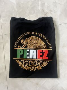 Show off your Mexican pride with this custom made Mexico shirt. May be personalized with a name of your choosing or a preferred state name.  If you need your item by a certain date please contact me so that we can work with you. If you have any problem with your order please feel free to contact us. T-Shirt:  Gildan Soft Style G6400 Solid Colors:4.5 oz/sq yd, 100% Ring Spun Cotton  Heathered Colors: 65% poly/35% cotton, Sport Grey 90%cotton/10%poly T-Shirt Care: Wash in cold cycle, inside out, n Fan Merchandise Tops With Custom Logo And Crew Neck, Fan Merchandise Crew Neck Tops With Custom Logo, Customizable Crew Neck Shirt For Fans, Mexican Names, Mexican Eagle, Mexico Shirt, Mexican Pride, T Shirt Business, Mexico Shirts