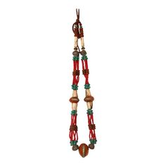 a long necklace with red and green beads