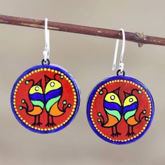 Two birds sing a joyful song in these bright, round dangle earrings designed by Indian artisan Ritu Thapar. Each earring is crafted from terracotta, then hand painted in colorful hues of red, blue, yellow, and orange. The artisan finishes the earrings with a glossy lacquer and gleaming sterling silver hooks. Round Dangle Earrings, Diy Jewlery, Hand Painted Earrings, Two Birds, Enamel Earrings, Enamel Jewelry, Hand Painted Ceramics, Hook Earrings, Leather Jewelry